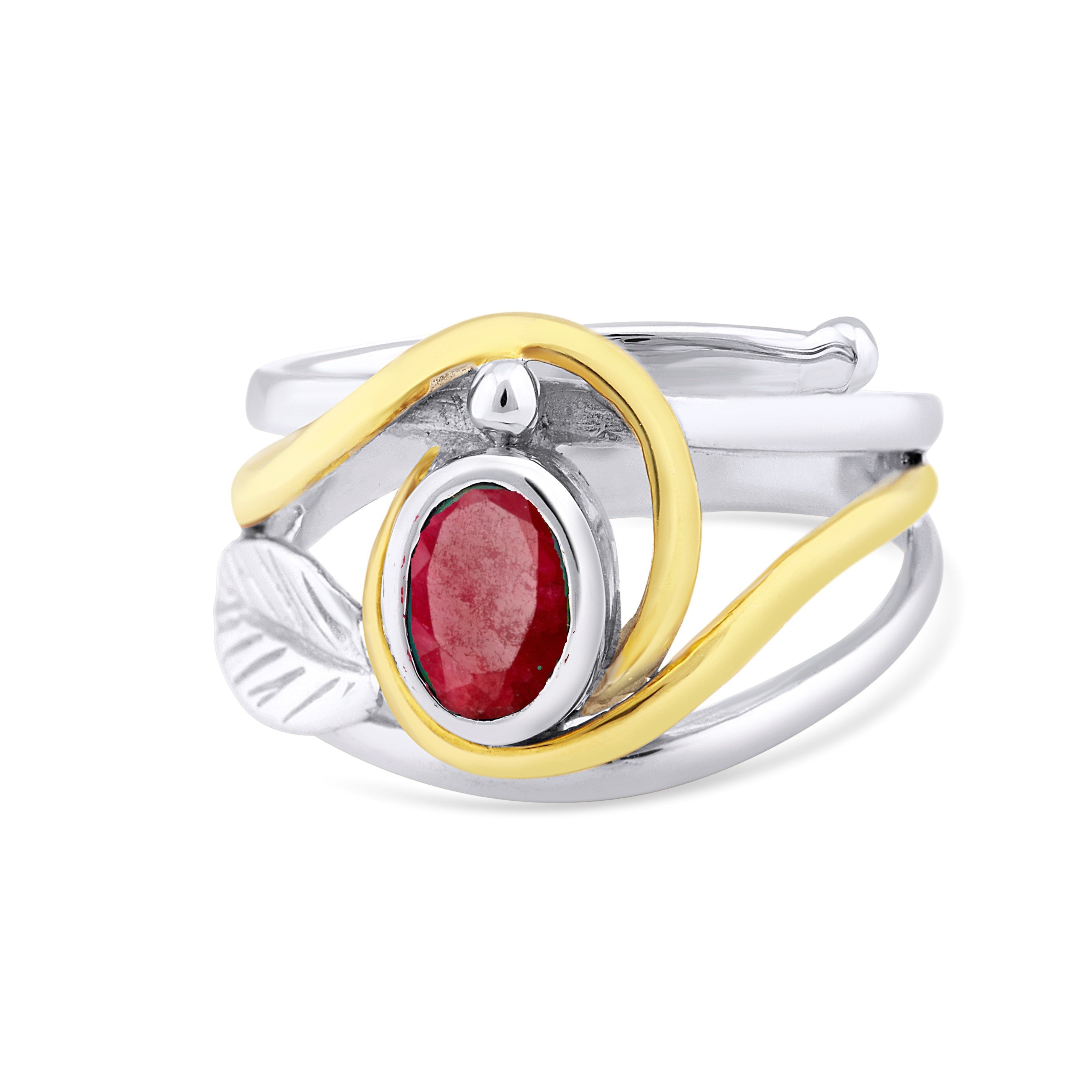Introducing the "Leaf Ring in Silver Gold & various gemstones" by Gallardo & Blaine Designs: A multi-band leaf ring featuring a vivid red oval gemstone set in a silver bezel at the center. The intertwined ring bands display silver & gold tones, while a de