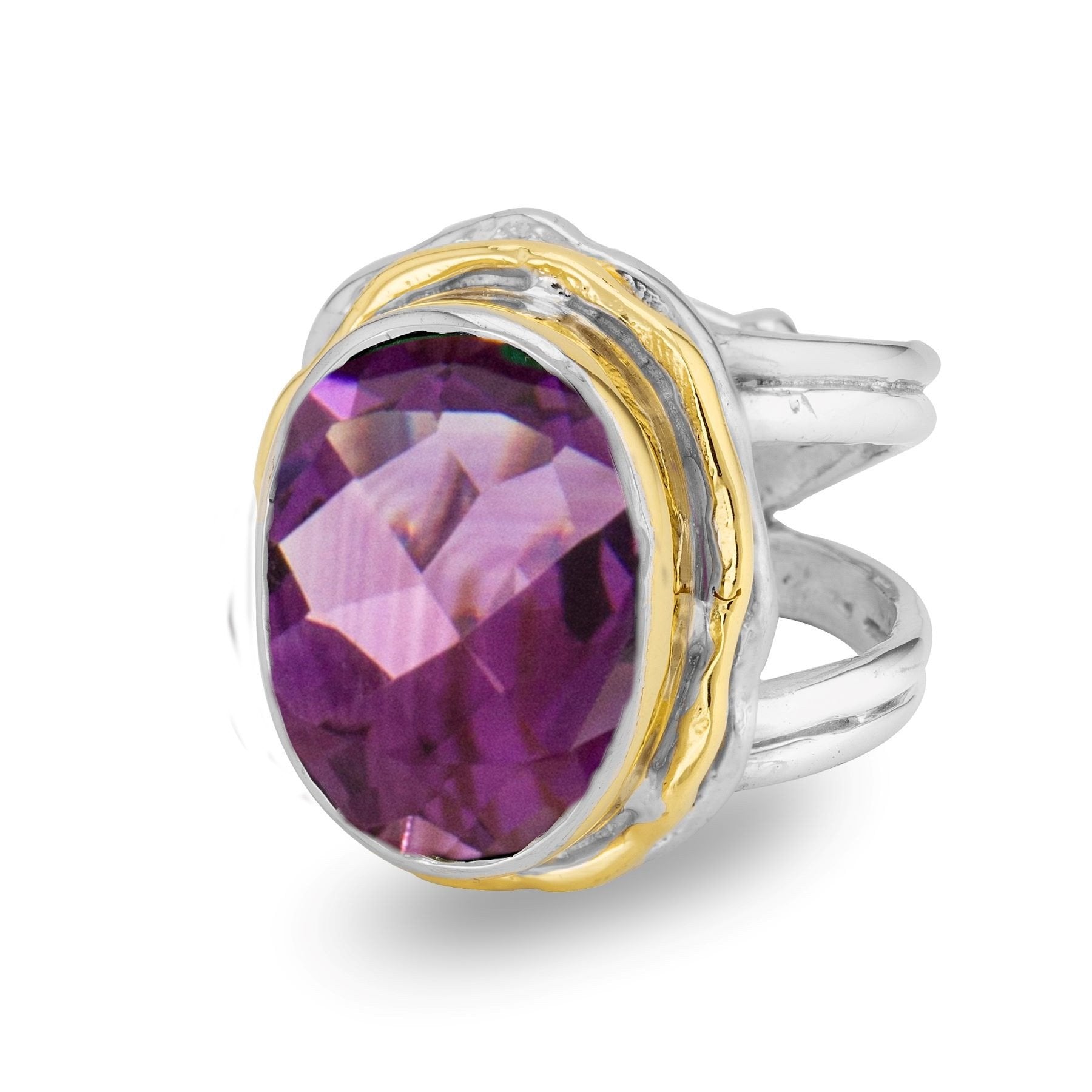 Introducing the Magnolia Ring in silver gold & various gemstones by Gallardo & Blaine Designs, a stunning statement piece crafted in sterling silver. This exquisite ring features a large, faceted purple gemstone set in a gold bezel. The band boasts a slig