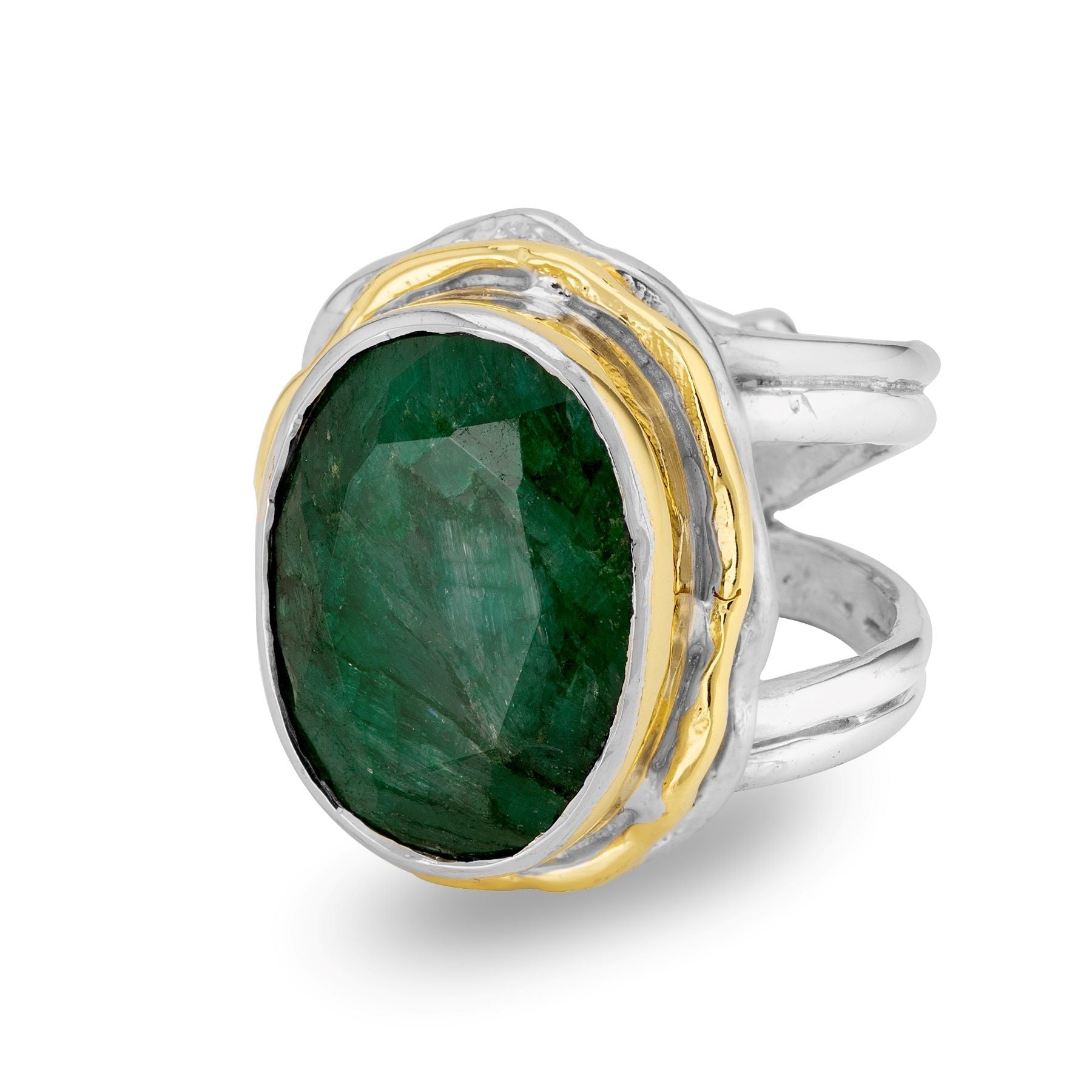 The Magnolia Ring in silver gold & various gemstones by Gallardo & Blaine Designs is a statement piece, featuring a large, oval-shaped green gemstone in a faceted cut. Set with gold accents on a sterling silver band that elegantly splits into multiple str