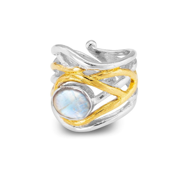 The Mayhem Ring in various gemstones by Gallardo & Blaine Designs features a chunky statement design with a silver and gold intertwined pattern, showcasing a prominent round gemstone. The silver bands act as the base, while gold bands wrap around in a cri