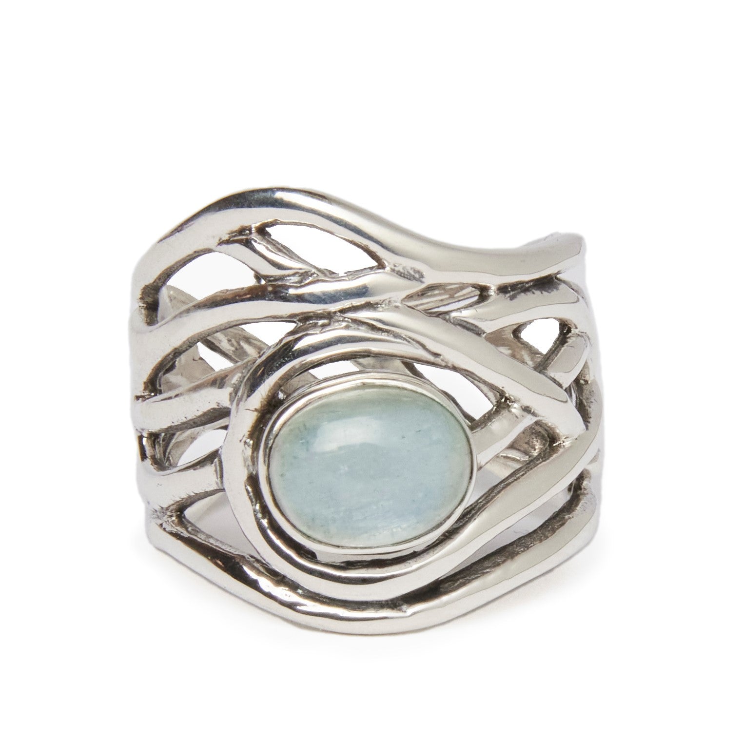 The Gallardo & Blaine Designs' Mayhem Ring in various gemstones features an intricate, flowing design that encapsules a smooth, light blue gemstone at its center. The openwork metal curves create an organic, wave-like pattern around the stone, offering a 