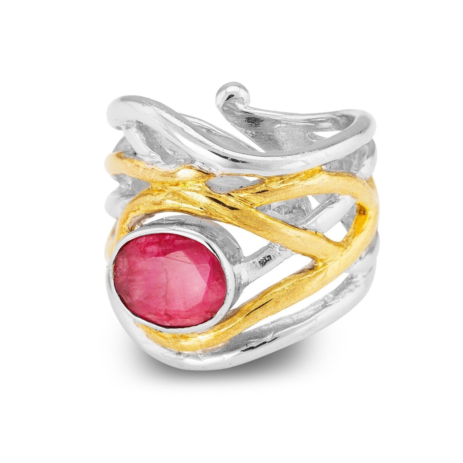 A silver and gold textured, chunky statement ring featuring an intricate design. The adjustable **Mayhem Ring in various gemstones** by **Gallardo & Blaine Designs** has a large, oval-shaped pink gemstone set in the center, with bands of silver and gold c