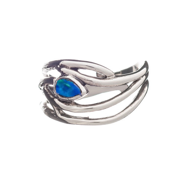 This elegant dainty ring features an intricate, overlapping design resembling branches or vines, with a prominent blue-green opal gemstone in the center. The Peacock Ring in various gemstones by Gallardo & Blaine Designs has a polished finish and an open,