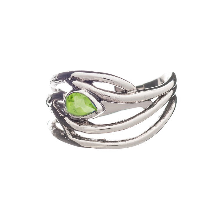 A Peacock Ring in various gemstones featuring an abstract, flowing design with a single, teardrop-shaped green gemstone set in the center. The band has intertwining loops, giving it a unique and modern appearance. This elegant dainty ring by Gallardo & Bl