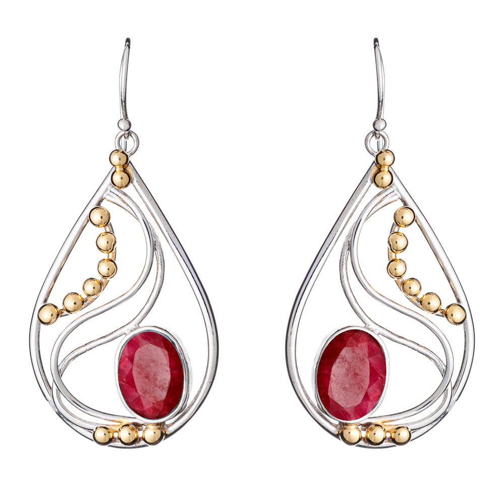 Introducing the Phoenix Earrings in various gemstones by Gallardo & Blaine Designs: a pair of elegant drop earrings featuring stunning red oval gemstones at the center of teardrop-shaped silver frames. Adorned with small gold beads and intricate silver sw