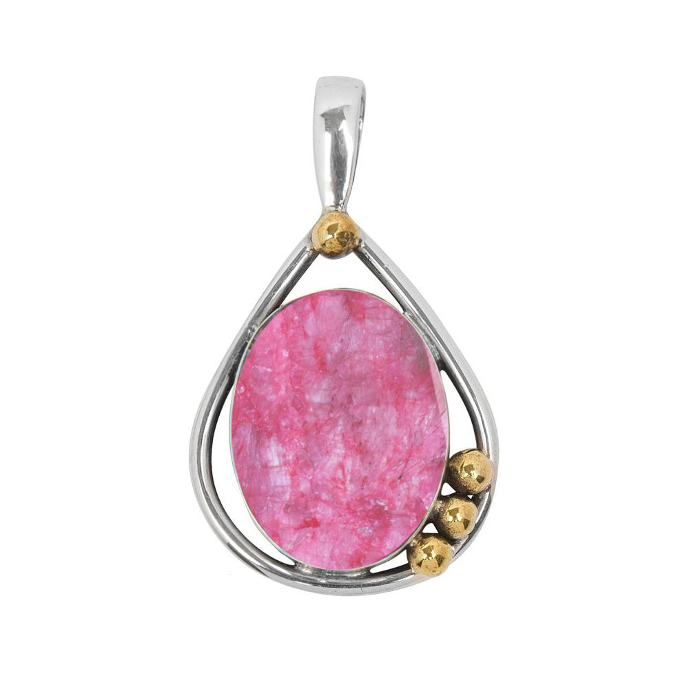 The Poppy Pendant Small in various gemstones by Gallardo & Blaine Designs showcases a teardrop-shaped pink gemstone set in a sterling silver frame with three small gold beads accenting the side. The pendant features a simple silver bail for attaching to a