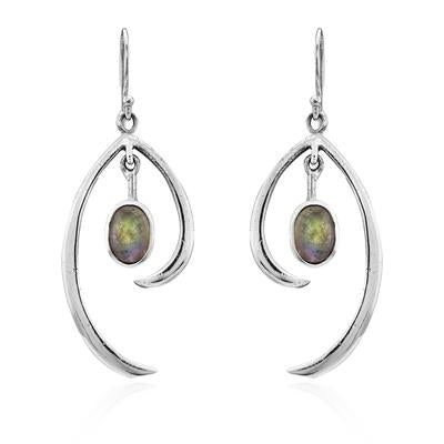 A pair of Primrose Earrings in various gemstones exemplifying minimalist elegance, these sterling silver earrings by Gallardo & Blaine Designs feature an abstract, curved design. Each earring has an oval-shaped gemstone with a dark, iridescent surface sus