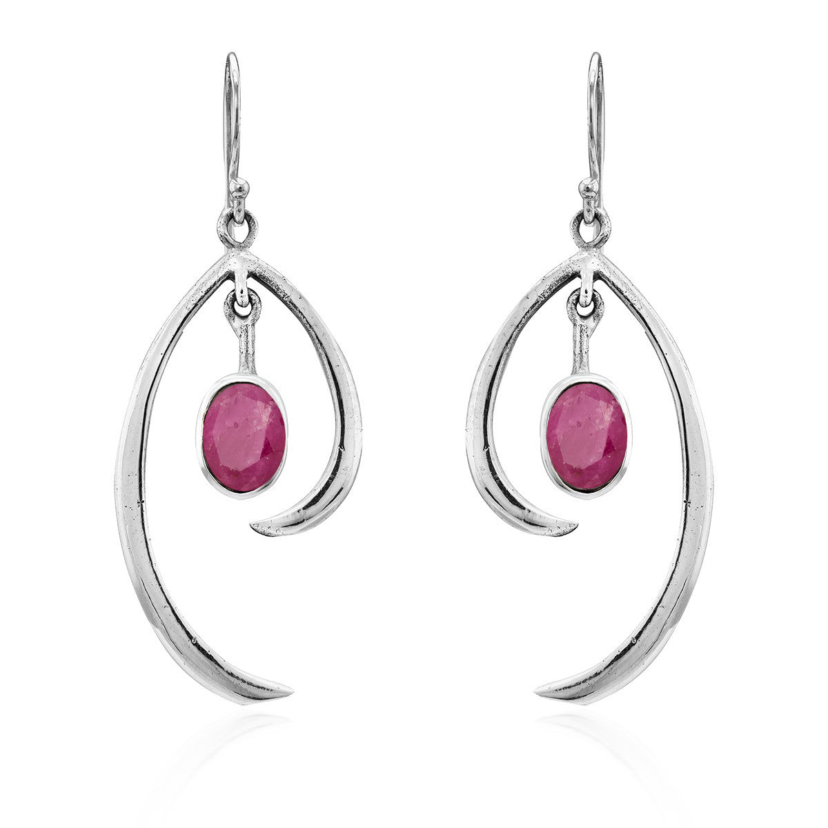 The Gallardo & Blaine Designs Primrose Earrings in various gemstones are a pair of sterling silver drop earrings featuring an elegant, curved design. Each earring showcases an oval-shaped pink gemstone hanging in the center. The minimalist elegance of the