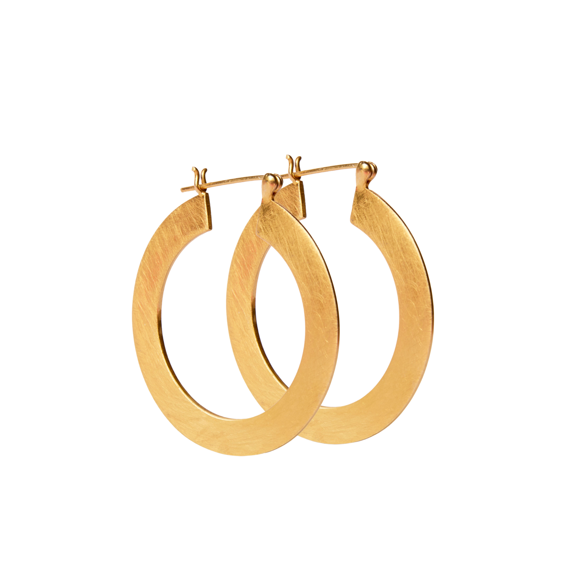 A pair of thin, gold vermeil Satin Hoop Earrings with a clasp fastening by Gallardo & Blaine Designs. The earrings have a smooth, polished finish and are suspended, showing their circular shape. The background is white, highlighting the shiny and elegant 