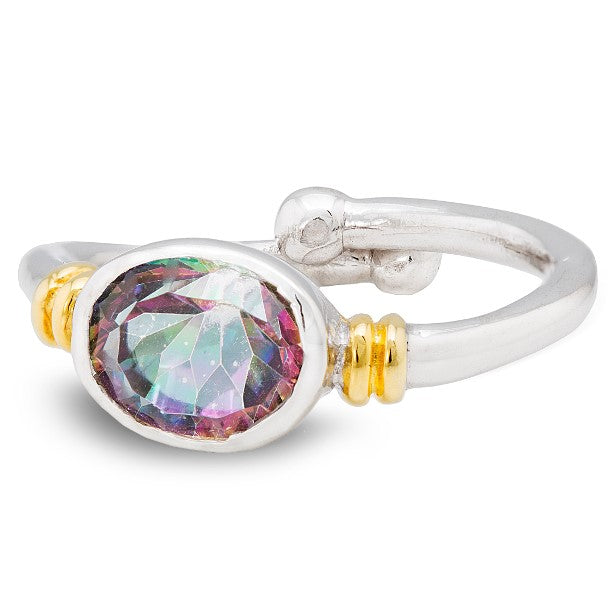 A silver adjustable Senna Ring in various gemstones by Gallardo & Blaine Designs with a large, oval, multicolored gemstone set in the center, flanked by two small gold accents on either side. The gemstone displays hues of green, purple, and pink, and the 