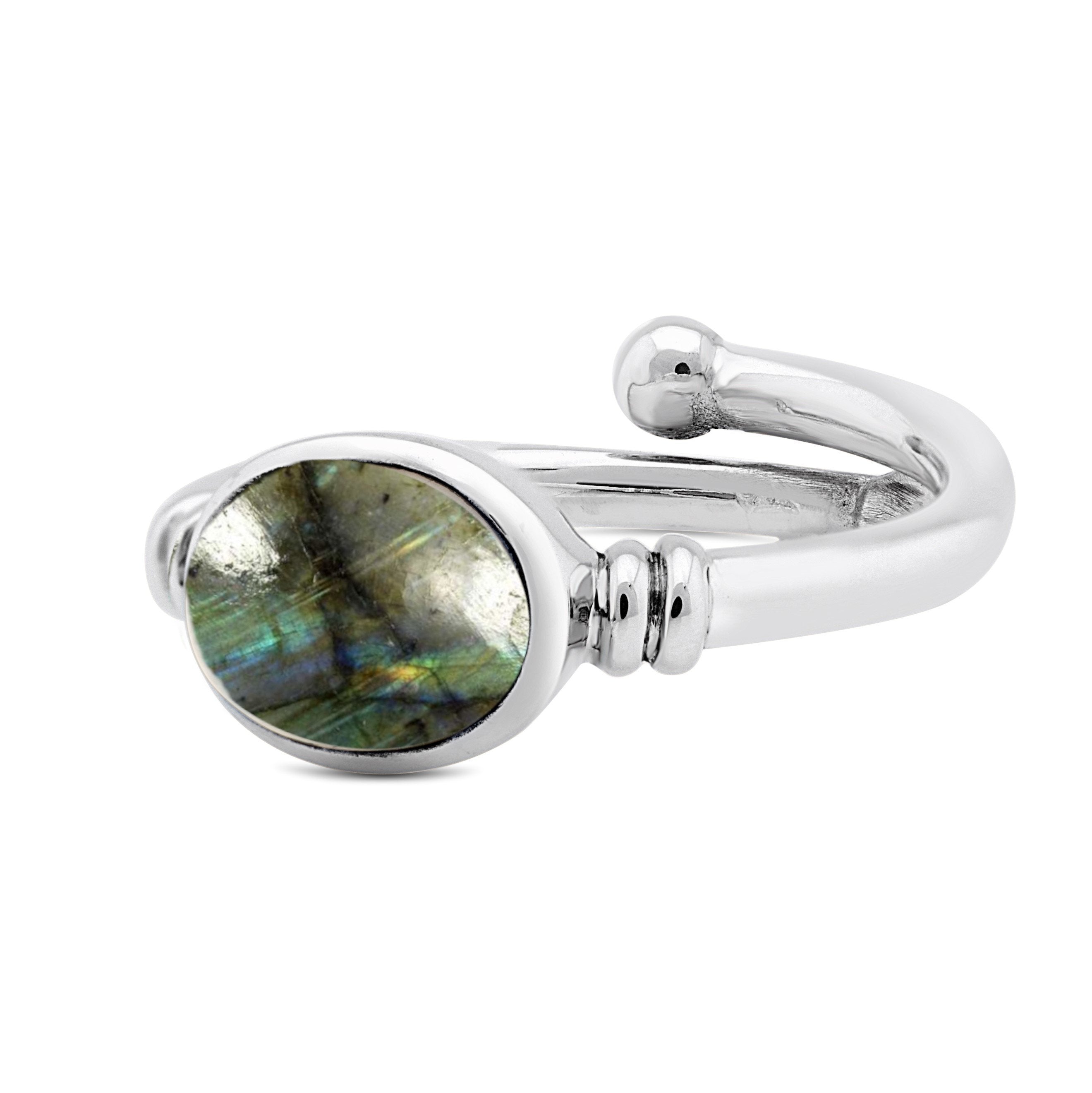 A Senna Ring in various gemstones by Gallardo & Blaine Designs with an oval labradorite stone that boasts an iridescent play of colors in shades of blue, green, and gray. The sleek, polished band features a minimalist design, making it the perfect blend o
