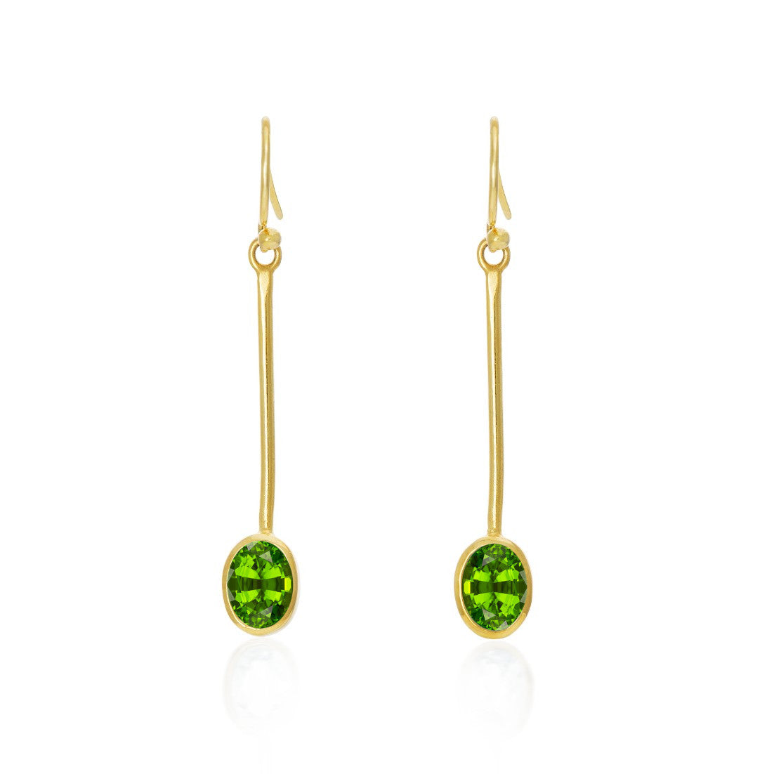 Gallardo & Blaine Designs Sequola Earrings in various gemstones: These gold drop earrings feature elongated hooks and long stems that elegantly end with oval green gemstones. Simple yet sophisticated, they showcase the bright green stones as the focal poi