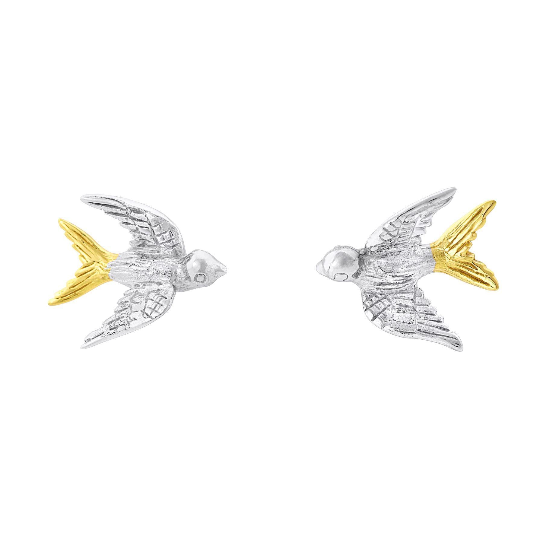 The Wildlife Swallow Studs by Gallardo & Blaine Designs feature a stunning bird-shaped design with intricately detailed wings in sterling silver and tails in gold vermeil. Each pair showcases birds facing each other, beautifully combining textures and col