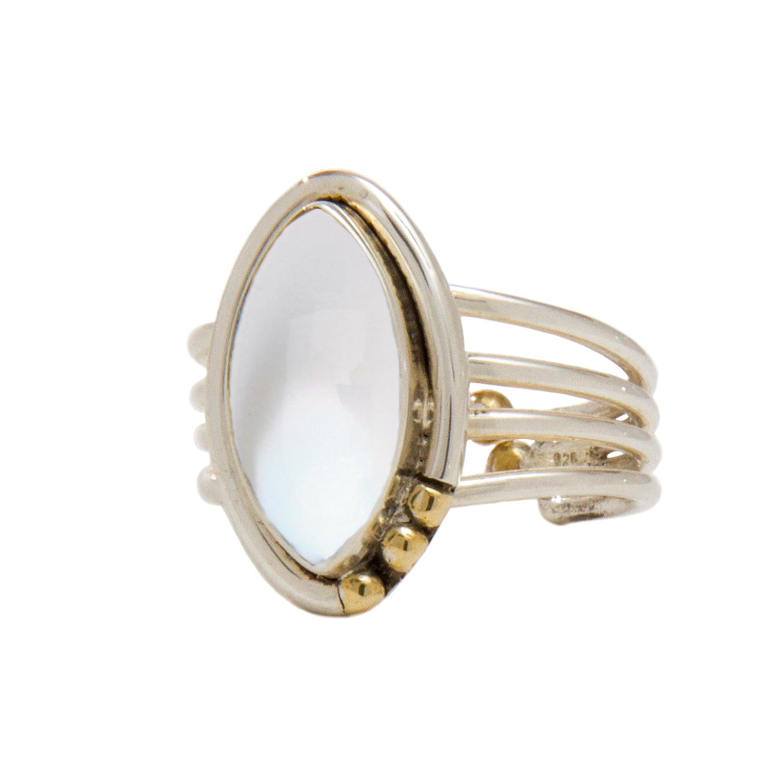 A silver Tulip Ring in various gemstones by Gallardo & Blaine Designs featuring an elongated oval-shaped, facet-cut white gemstone. The band splits into three distinct strands on each side of the stone, and small gold accents are positioned on one side of