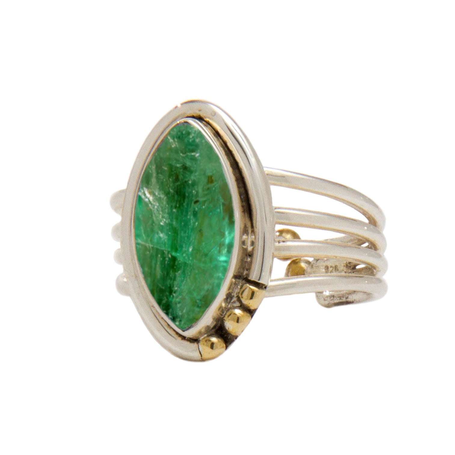 A Tulip Ring in various gemstones featuring a large, marquise-cut green gemstone set in a modern, multi-band, silver and gold setting. The bands are intertwined, with gold accents near the base of the gemstone. The ring from Gallardo & Blaine Designs has 