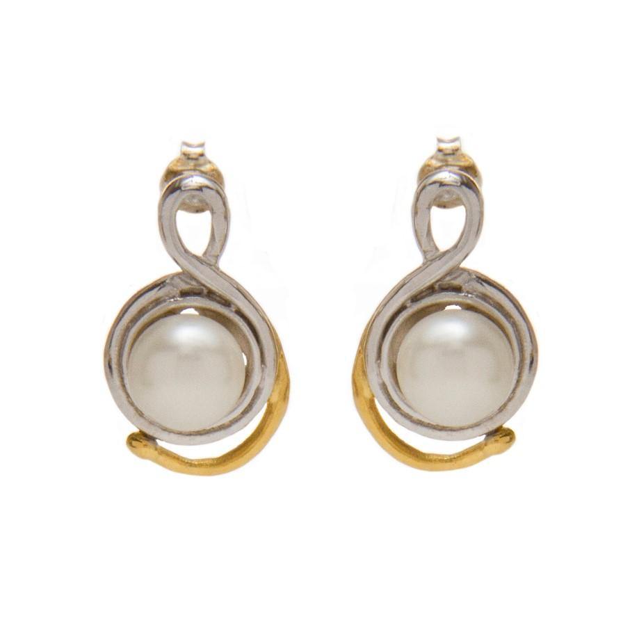A pair of Gallardo & Blaine Designs Wave Earrings featuring a round fresh water pearl set in the center of a gold and silver twisted wire design. The symmetrical and elegant pattern, with the gold wire accentuating the bottom loop, exudes a modern and sop
