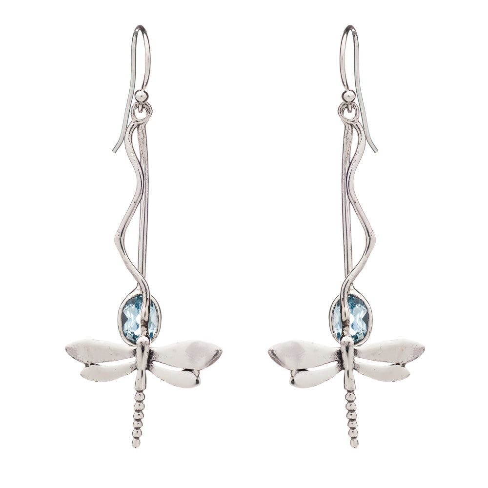 A pair of silver dangle earrings featuring intricate silver dragonfly designs. Each dragonfly is adorned with a light blue gemstone at its center, and the earrings have long, elegant hooks that resemble twisting vines. Introducing the Willow Earrings in V