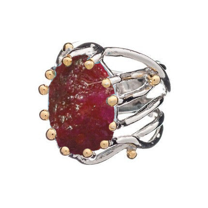 Introducing the Willow Ring in various gemstones by Gallardo & Blaine Designs, an eye-catching chunky statement gemstone ring. This adjustable silver piece showcases a large, rough-cut red gemstone secured by prongs. The intricately designed band resemble